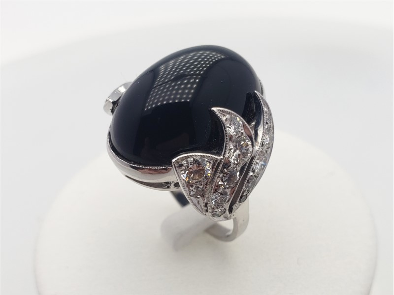 black onyx ring with diamond in center